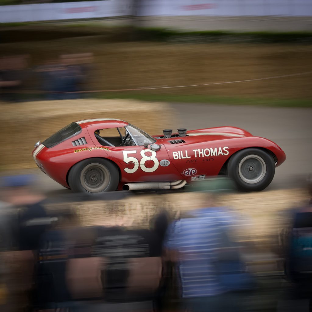 The Cheetah-Chevrolet races up the hill at Goodwood